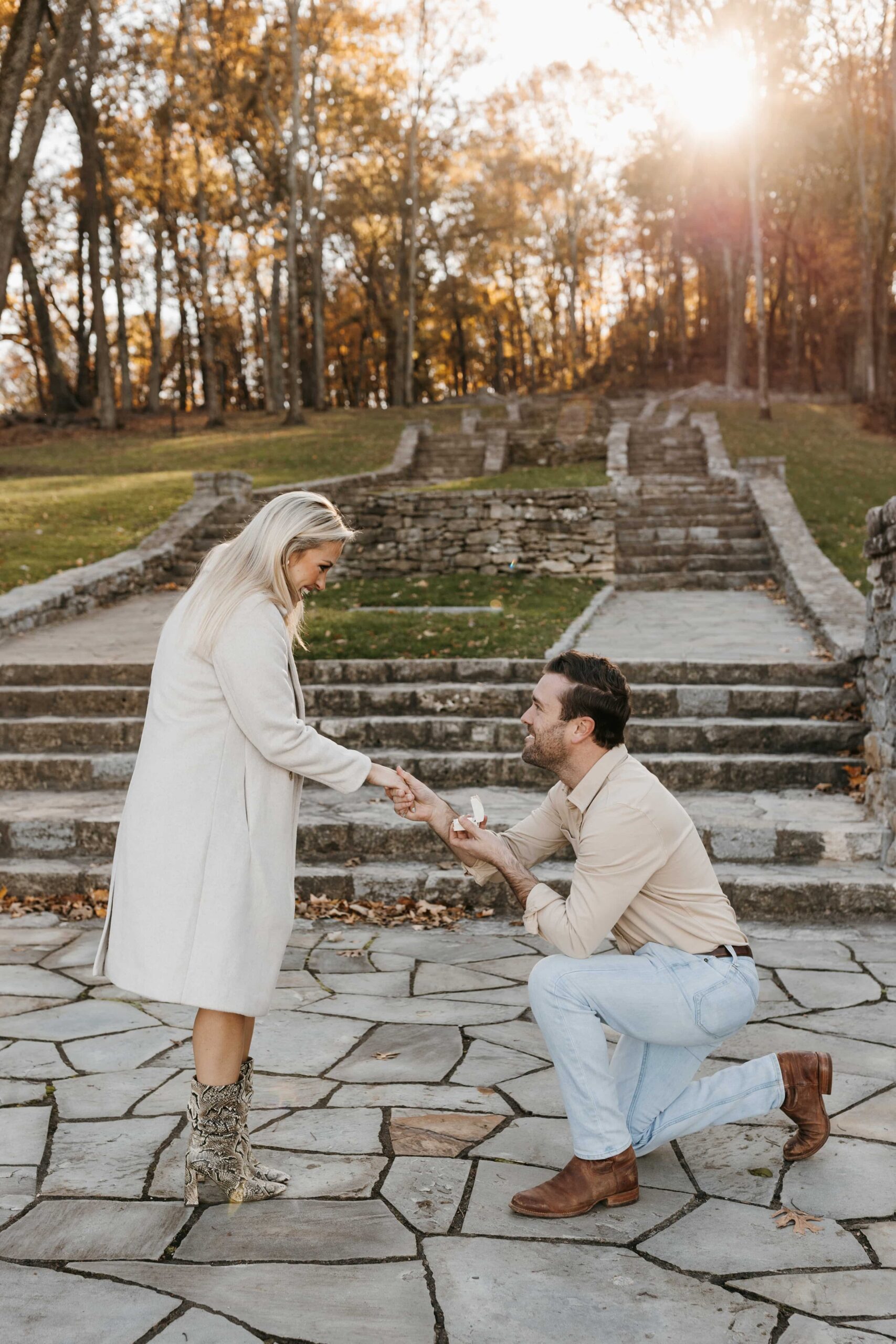 Couple during a surprise proposal at a scenic Nashville location