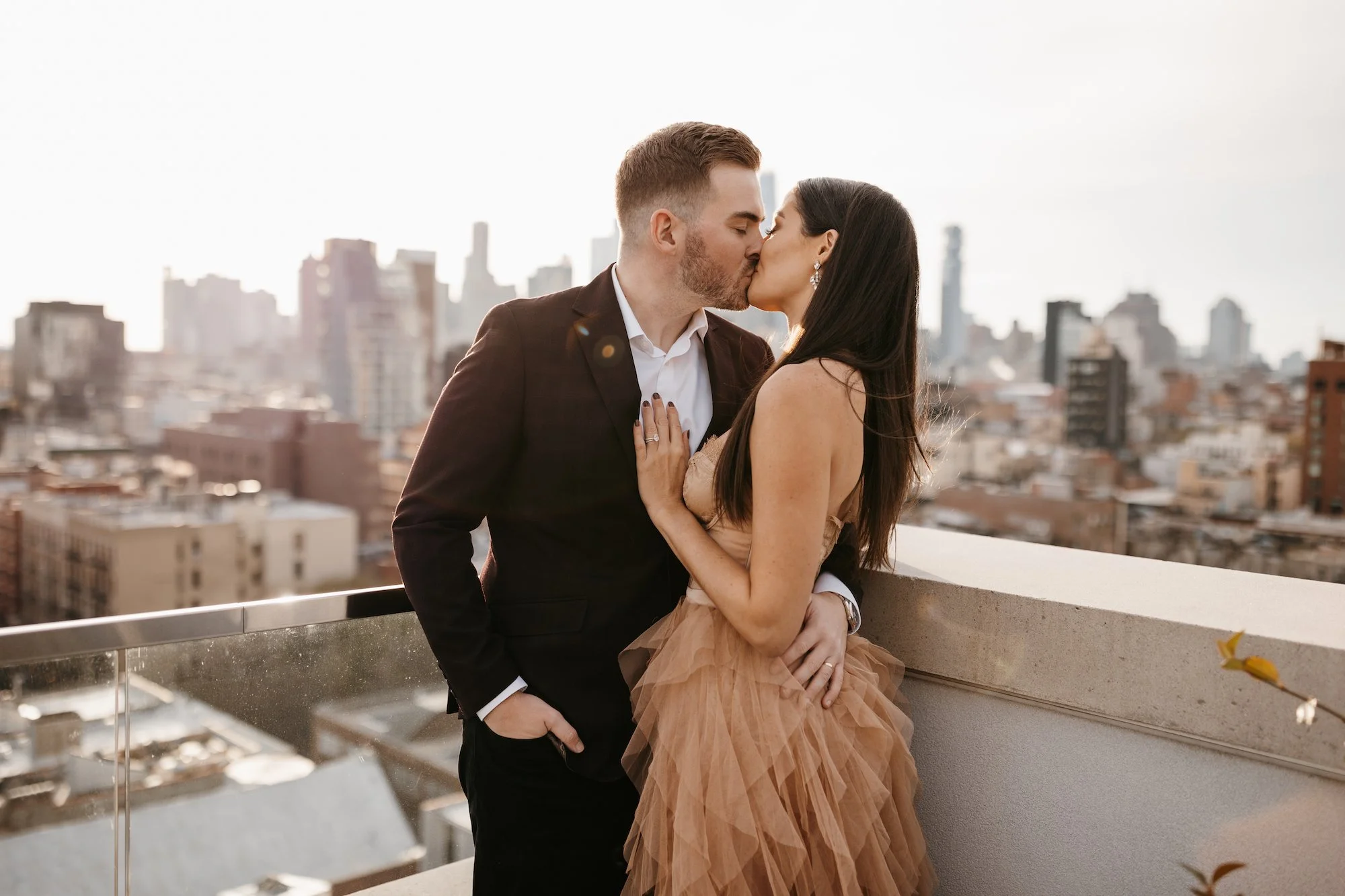 Couple kissing on a Nashville rooftop
